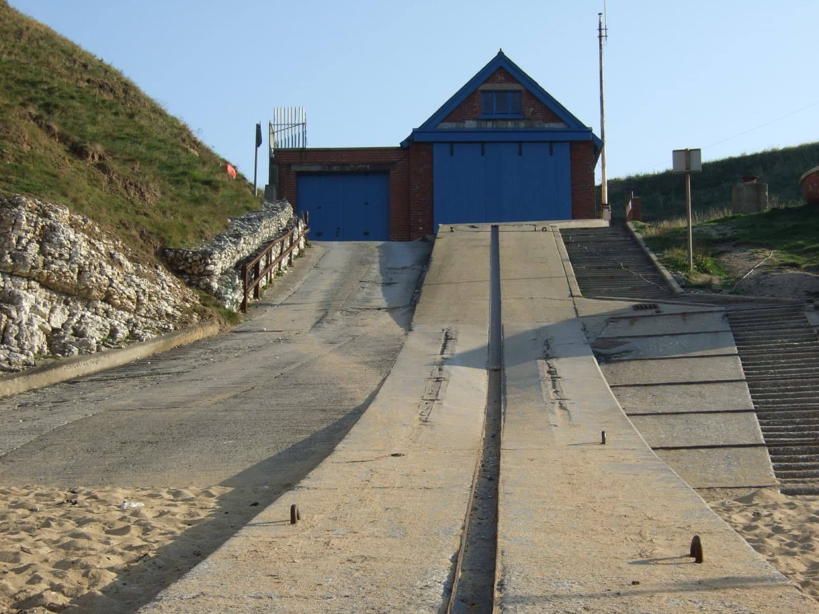 The old North Landing lifeboat station and its launch ramp running down to the cove